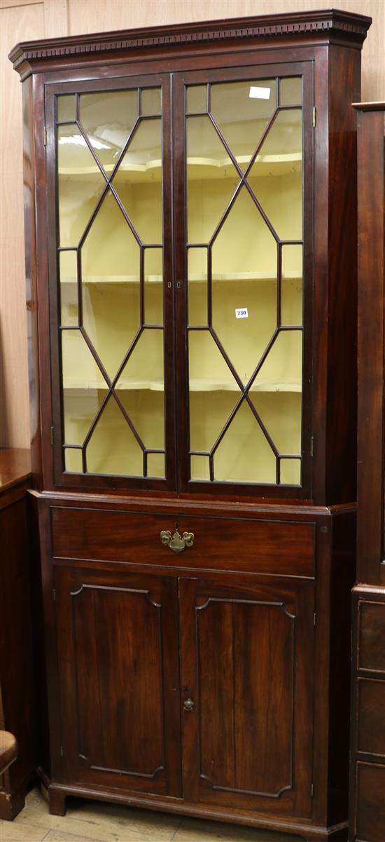 A George III mahogany corner cupboard W.100cm